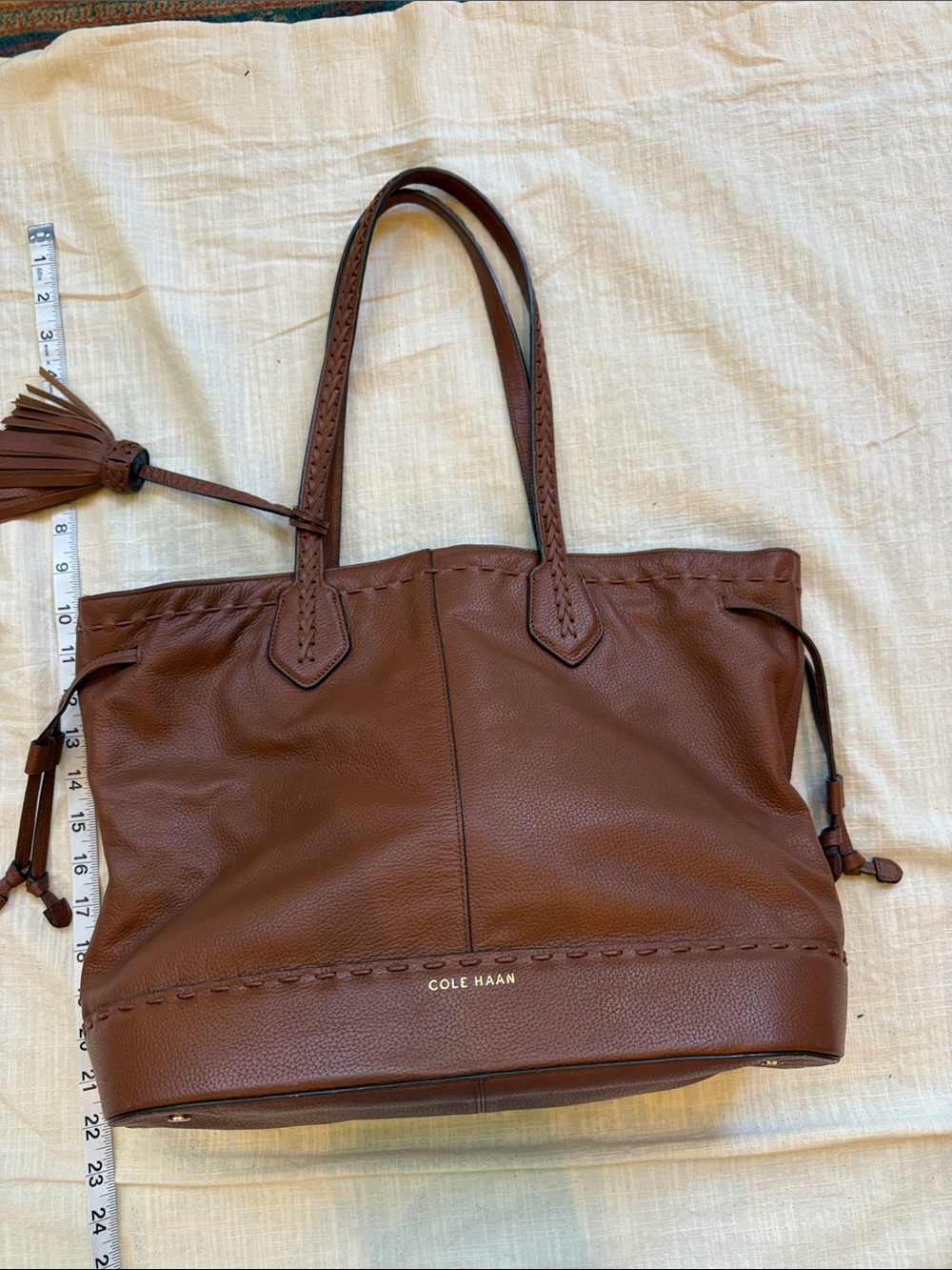 Cole Haan real leather brown tote with braided trim and tassle